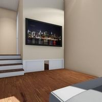 Schlafzimmer mit einem Bett, einem Fernseher und einer Treppe, die eine gemütliche Atmosphäre schafft.